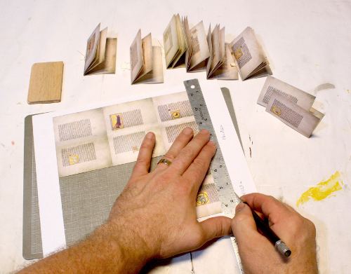 Cutting out the miniature Romanesque Bestiary by Randy Asplund